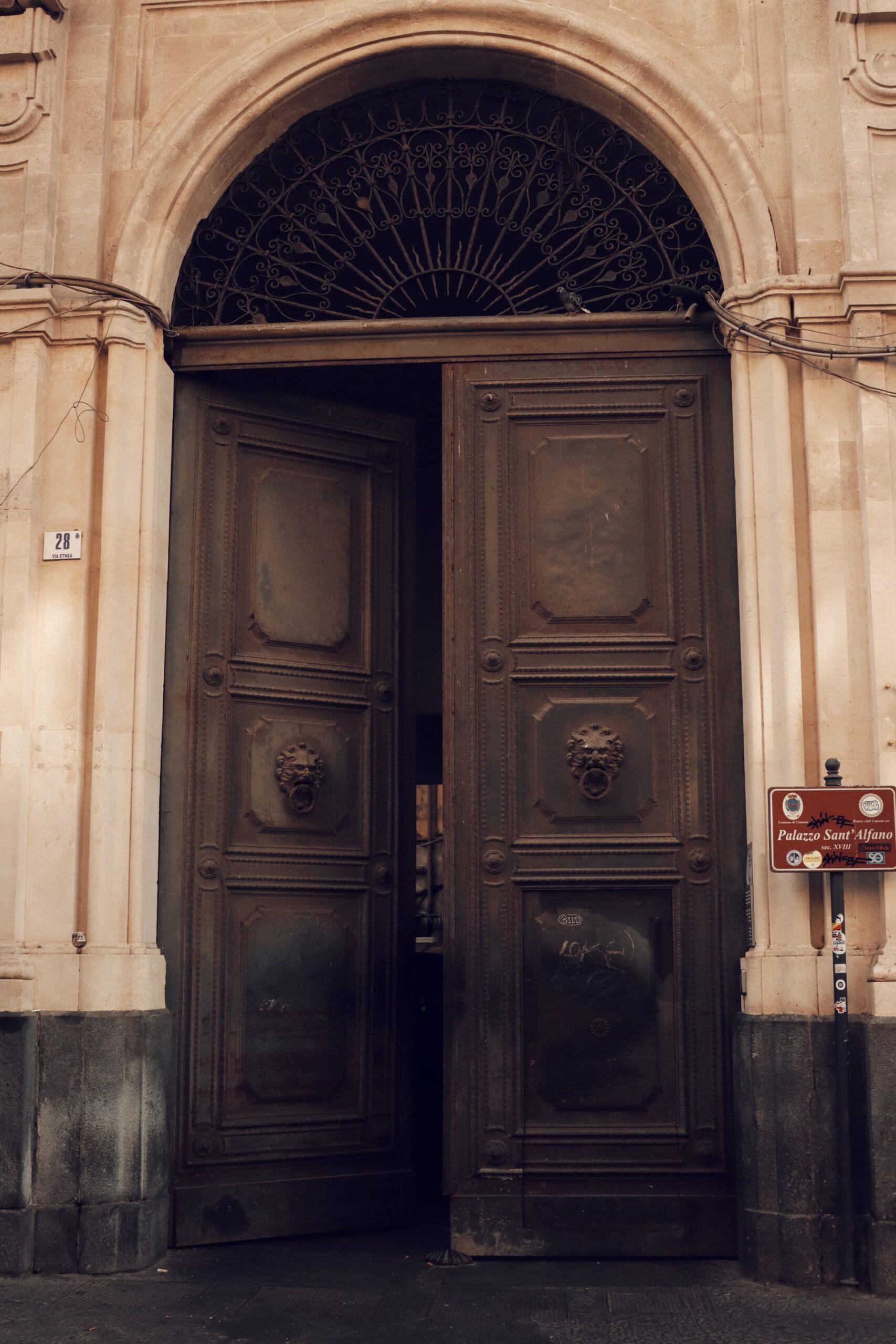 Dismantled palazzo portal with reclaimed carved stone blocks