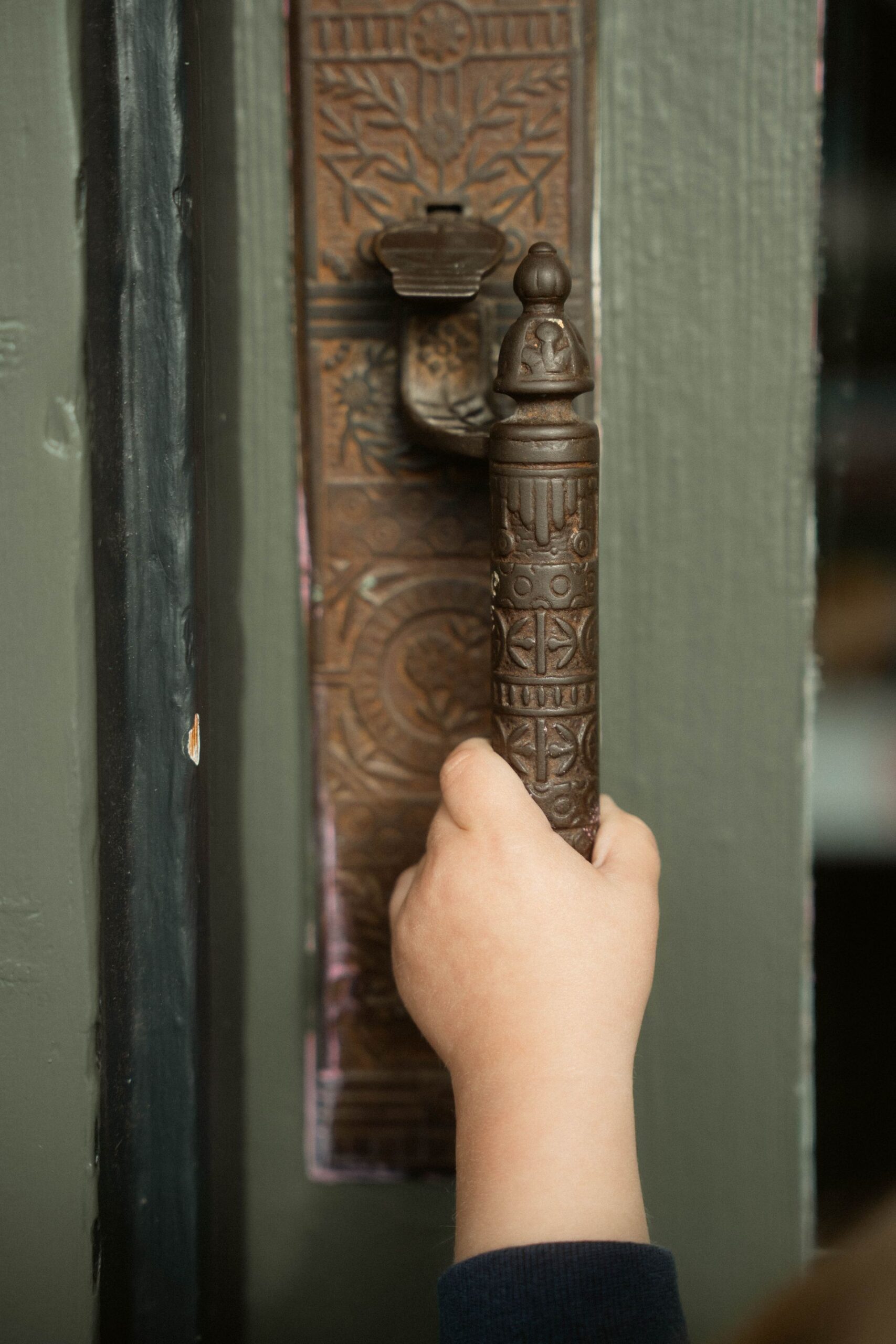 Artisan hand-finishing a cast bronze element